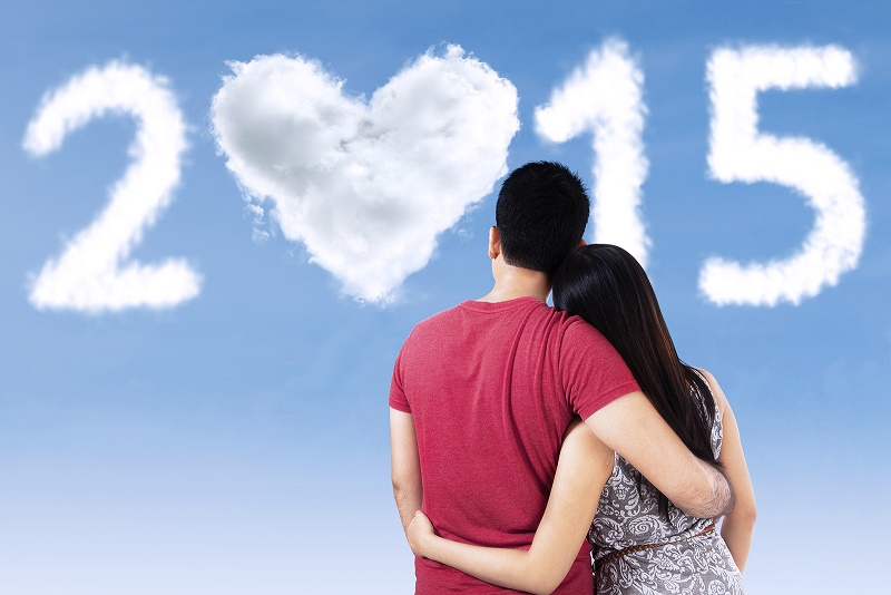 Couple Looking forward to the New Year 2015, setting resolutions